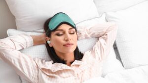 Woman wearing earplugs.