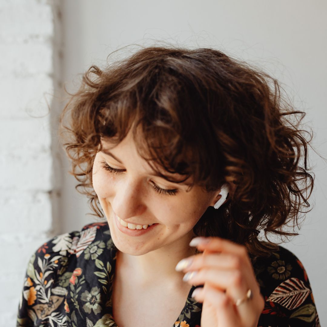 woman using Airpods