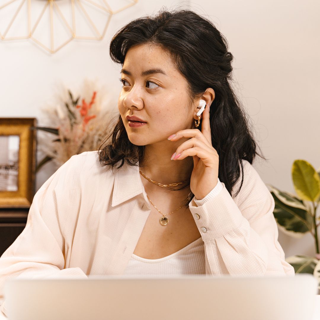 woman using Airpods