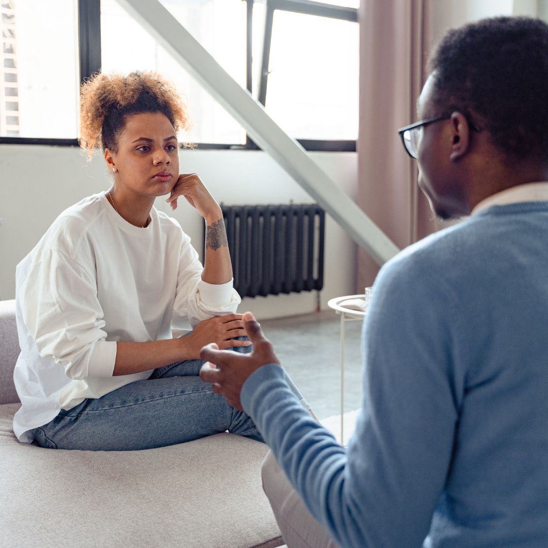 A woman and a man talking