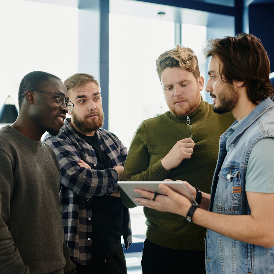 A group of people talking to each other