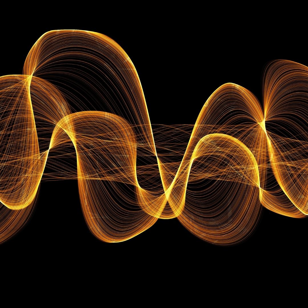 Abstract orange and gold sound waves on a black background.