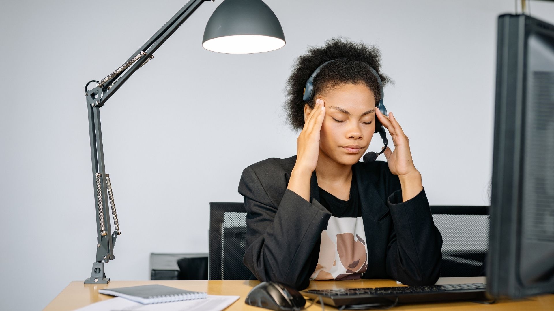woman with hands on head